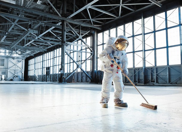 Astronaut sweeping a hangar