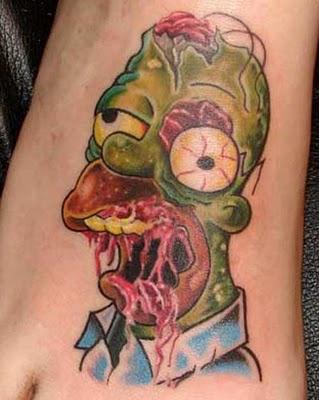 Homer Simpson tattoo on the back of the right arm