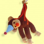 monkey nailed to wall plush doll image