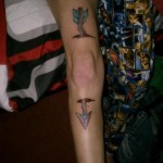 Arrow to the knee tattoo