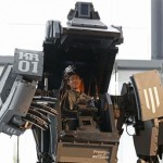 Robotics expert Yoshizaki demonstrates how to operate the arm of a giant “Kuratas” robot in Tokyo